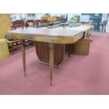 An Art Deco Walnut Extending Dining Table, with a carved moulding on trestle supports, chrome
