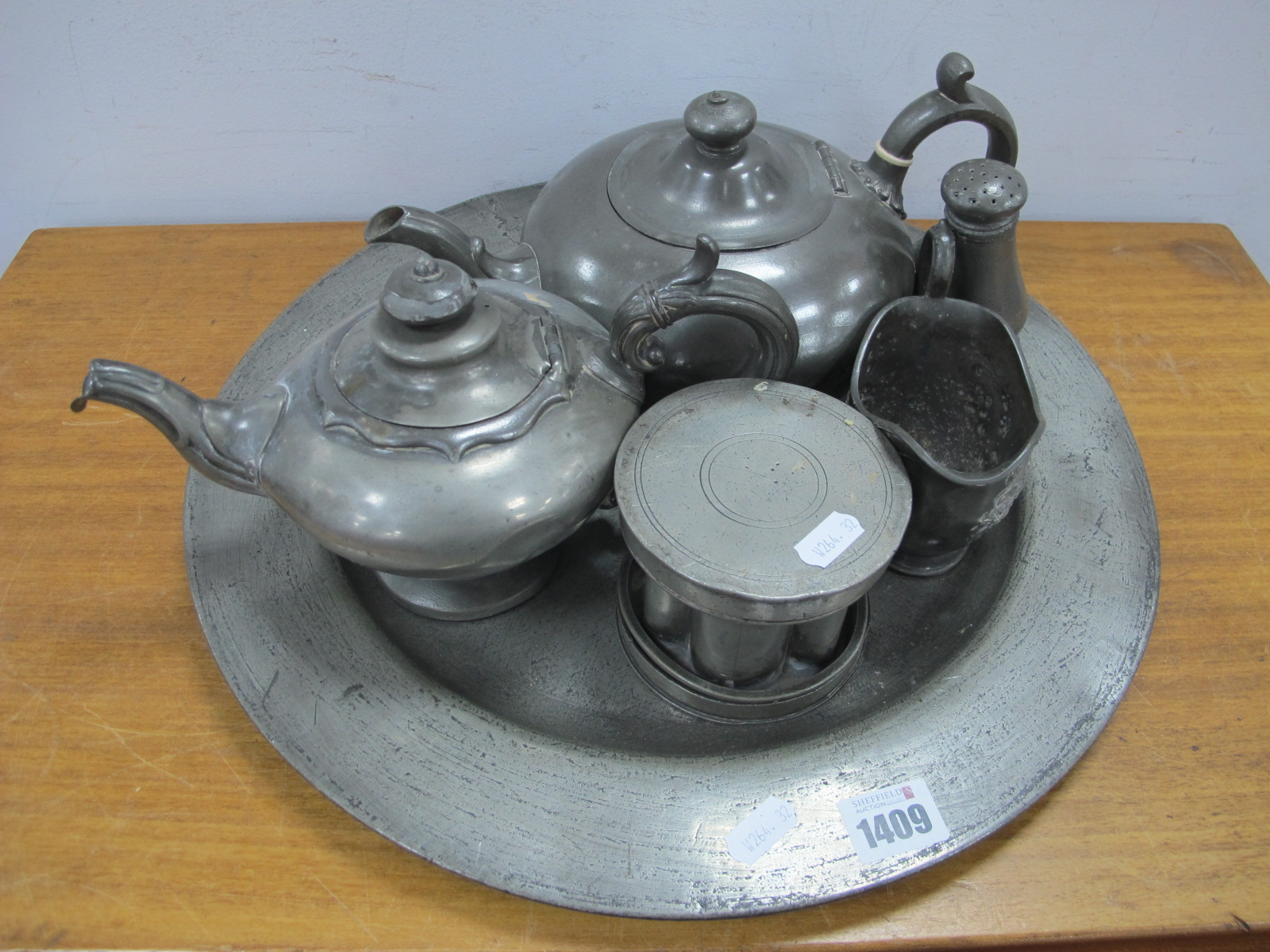 A Pewter Charger 40cm diameter, XIX Century pewter ice cream mould with detachable lids to both ends