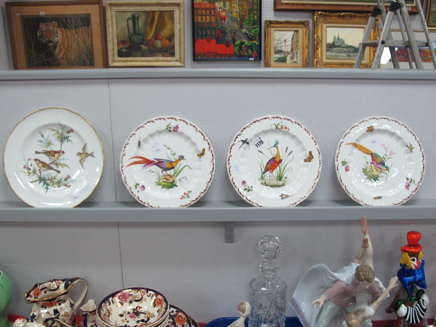 XIX Century Painted Porcelain Plates, each featuring exotic birds, butterflies and insects, gold