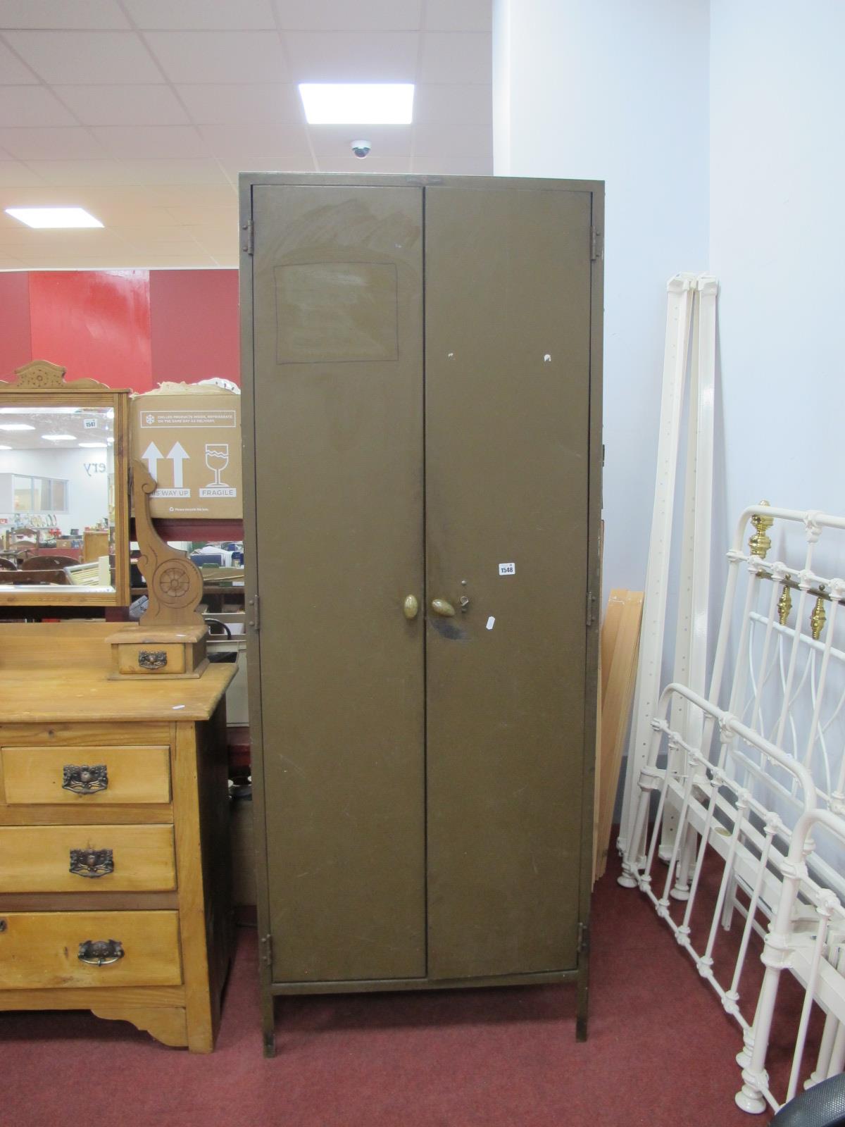 A Green Painted Metal Two Door Office Cabinet, with internal shelves, 71.5cm wide.