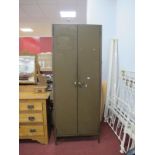 A Green Painted Metal Two Door Office Cabinet, with internal shelves, 71.5cm wide.