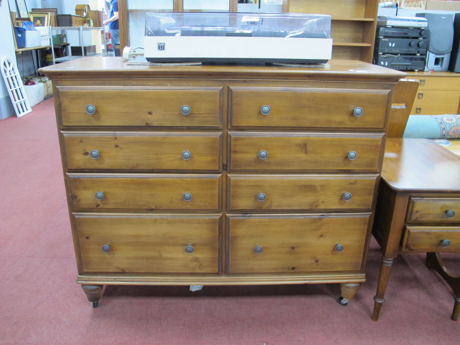 Ducal Pine Chest of Eight Small Drawers, on turned feet.