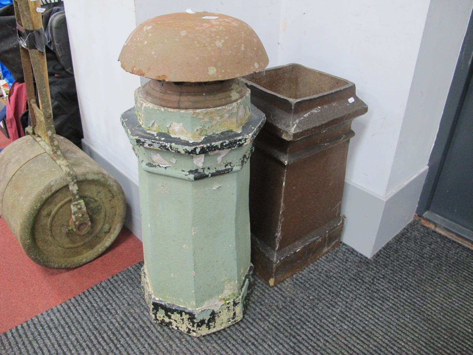 A Square Top Chimney Pot; together with a painted octagonal shaped chimney pot and a terracotta