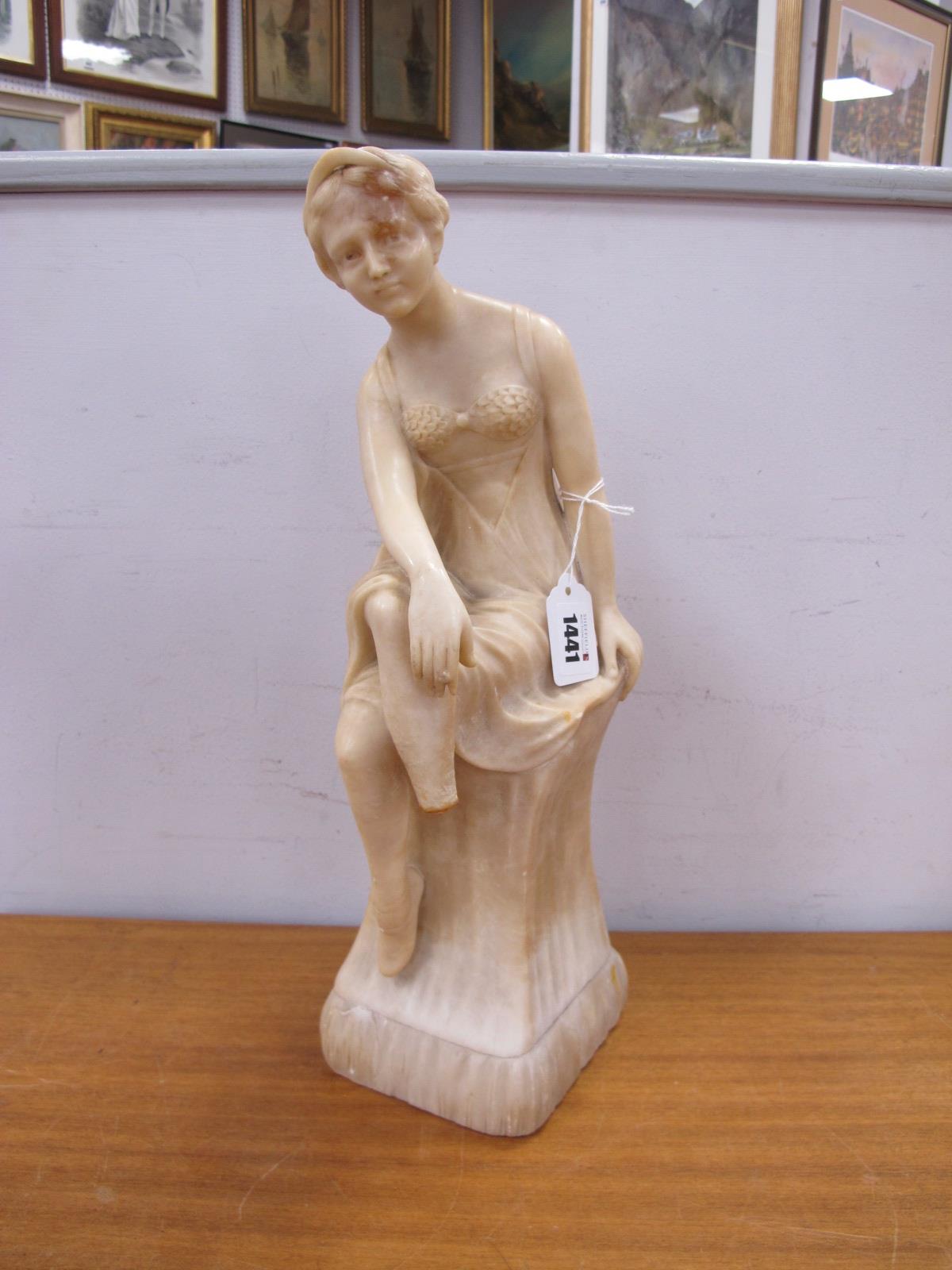 Alabaster Figure of a 1920's Lady, seated upon plinth (her right lower leg absent) 41cm high.