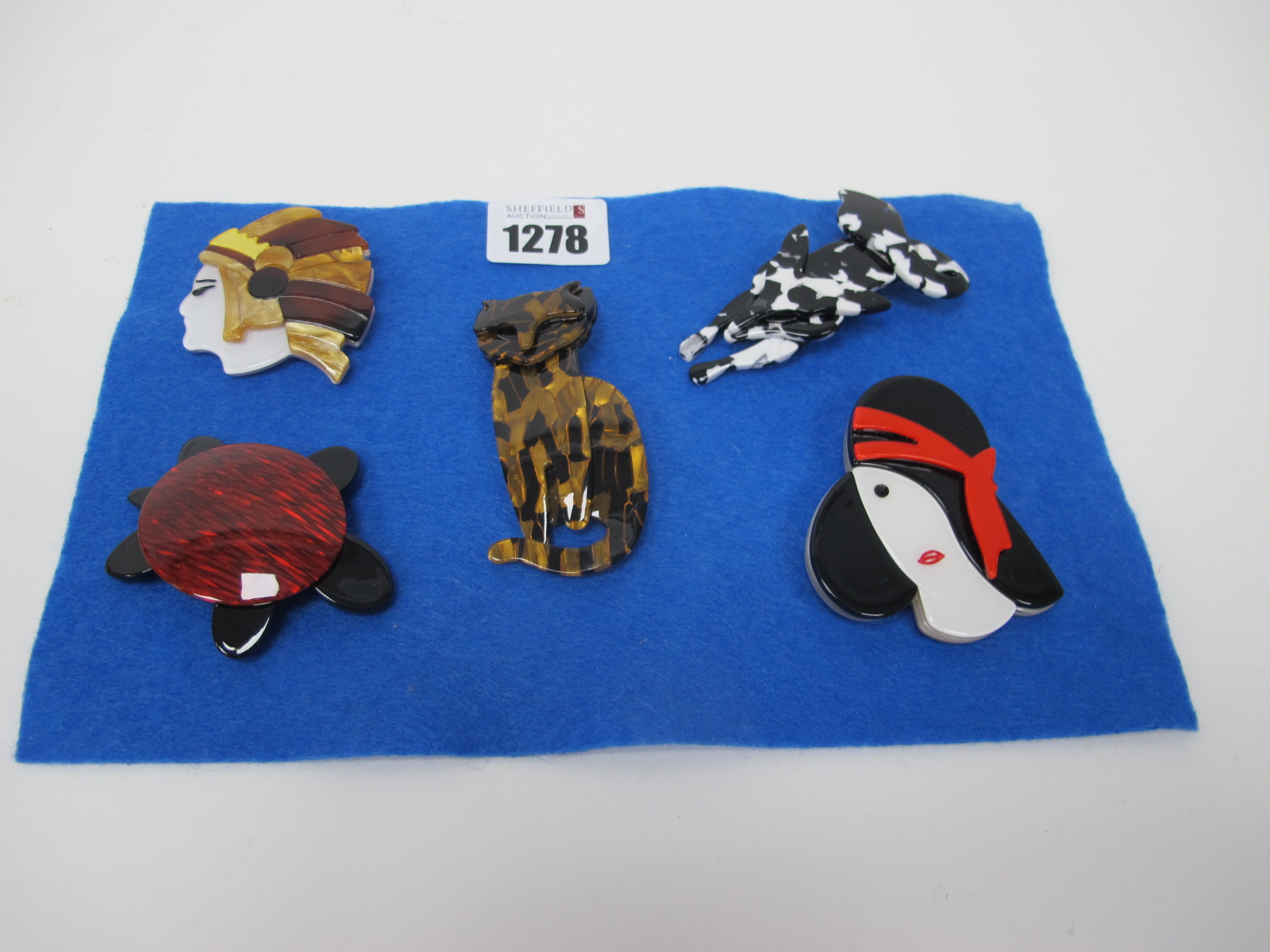 Five Modern Brooches.