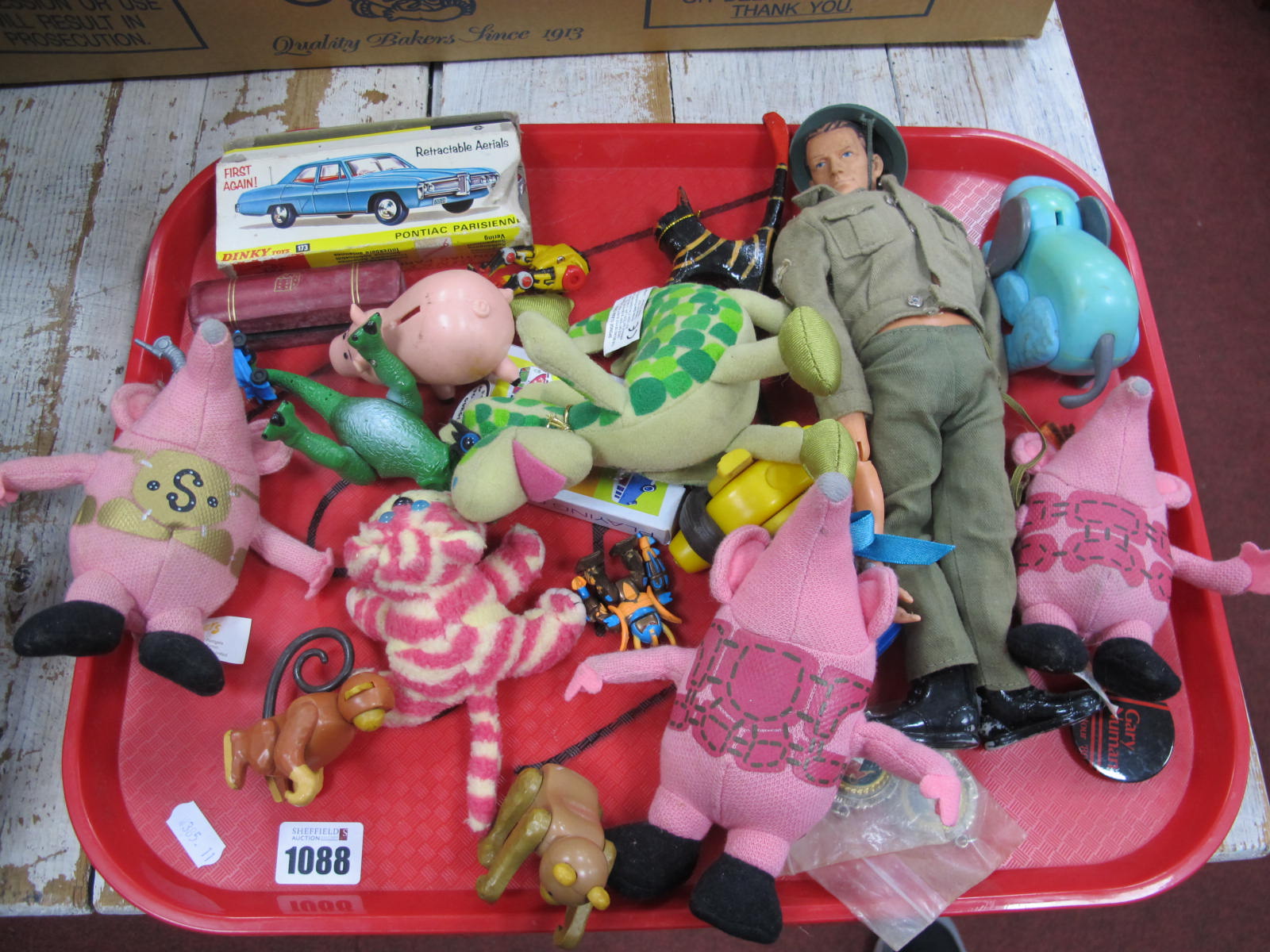 Dinky Pontiac Parisienne 173 (Red), in damaged box, soft toys, dice, Gary Numan badge, etc:- One