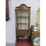 An Early XX Century Mahogany Display Cabinet, with shaped top, glazed astragal door, two internal