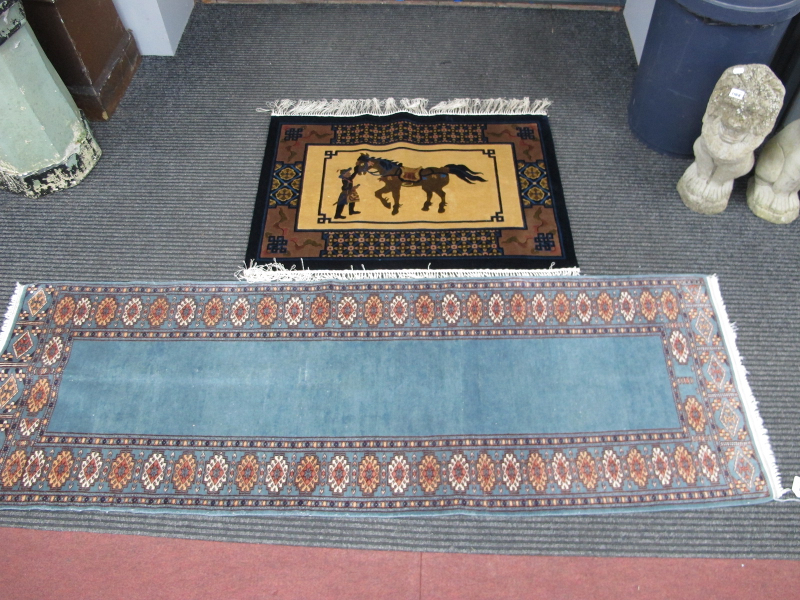 A Chinese Wool Tassled rug, featuring horse and tether, 92 x 63cm. A runner with geometric motifs on