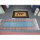 A Chinese Wool Tassled rug, featuring horse and tether, 92 x 63cm. A runner with geometric motifs on