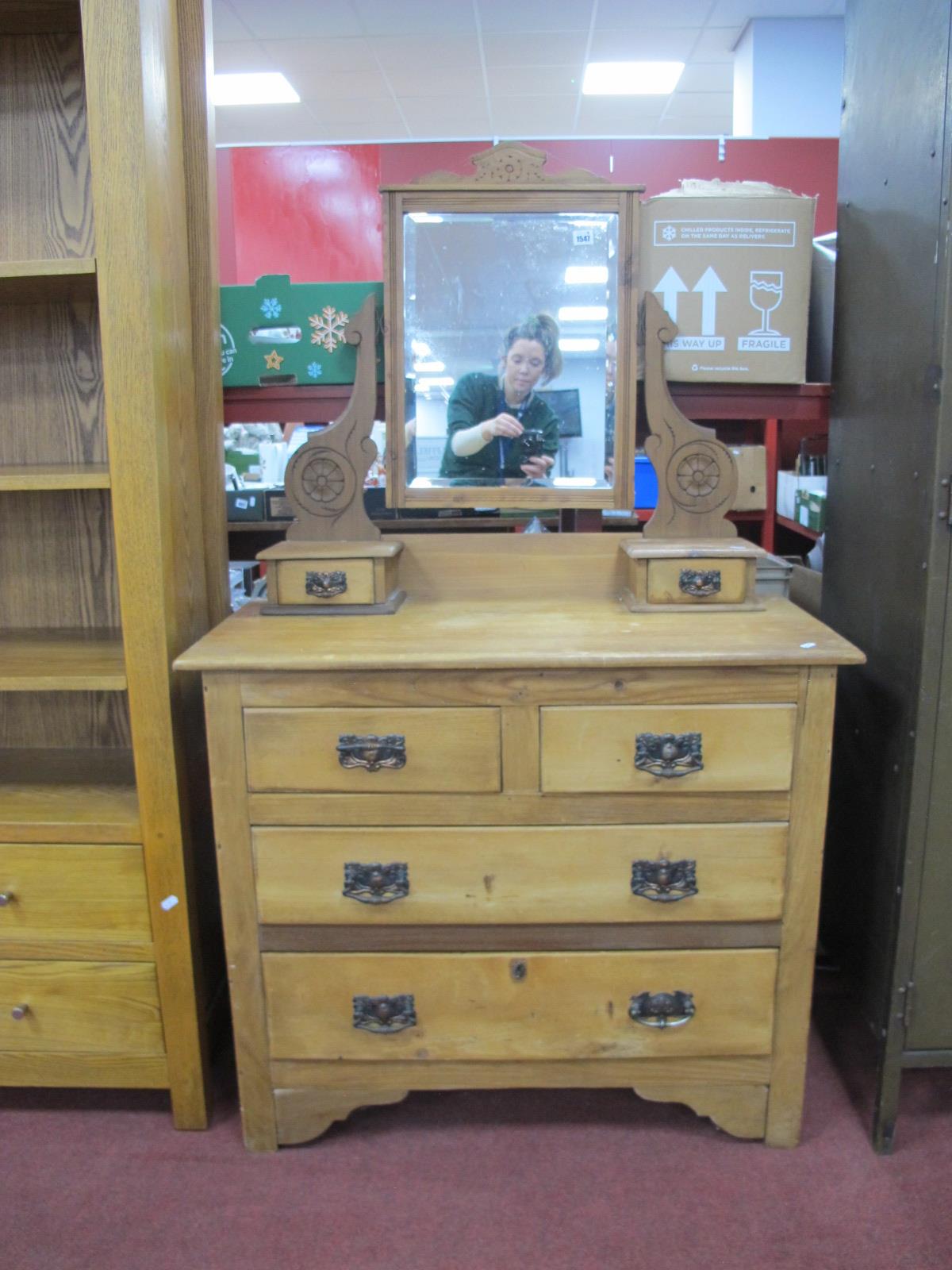 And Edwardian Pine Dressing Table, with a central mirror, shaped supports, two jewel drawers, base