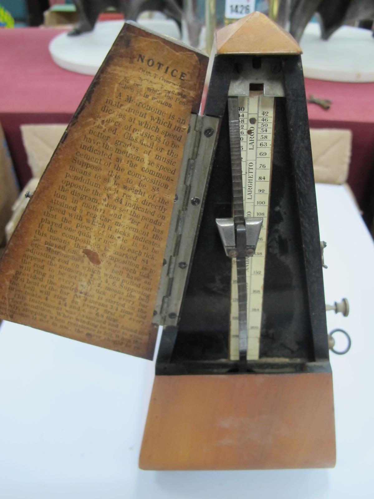 A XX Century Brass Anniversary Clock Under a Glass Dome, together with a XX Century Metronome in a - Image 2 of 4