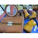 An Edwardian Wooden Shield Backed Adjustable Shaving Mirror, a leather cased gent's travel case with
