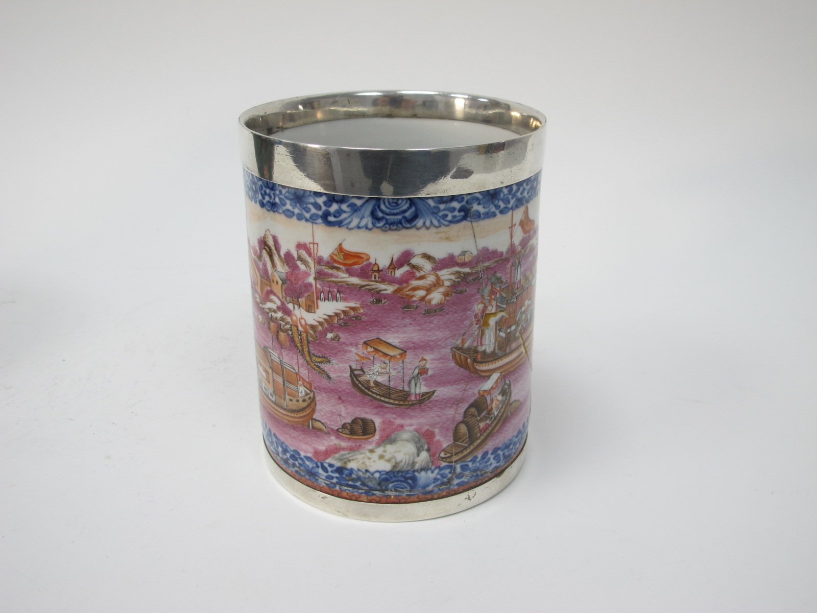 A XIX Century Porcelain Tankard, featuring Chinese junk scene, Dragon handle, plated rim and base (