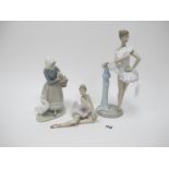 A Lladro Ballet Dancer 6371, 30cm high, seated ballerina, lady with goose. (3)
