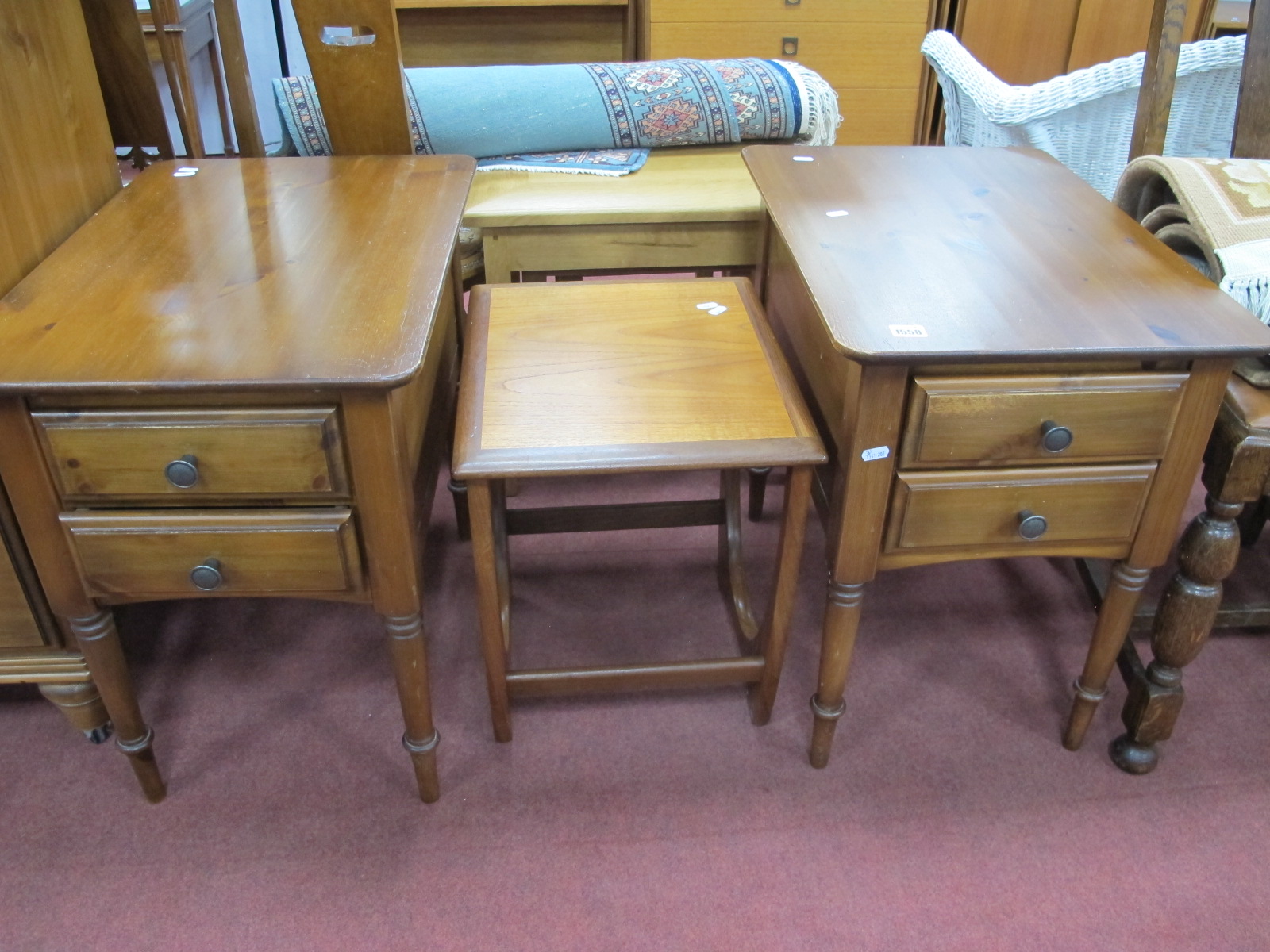 A Pair of Crown Ducal Pine Bedside Chests, with two small drawers, on turned legs; together with a