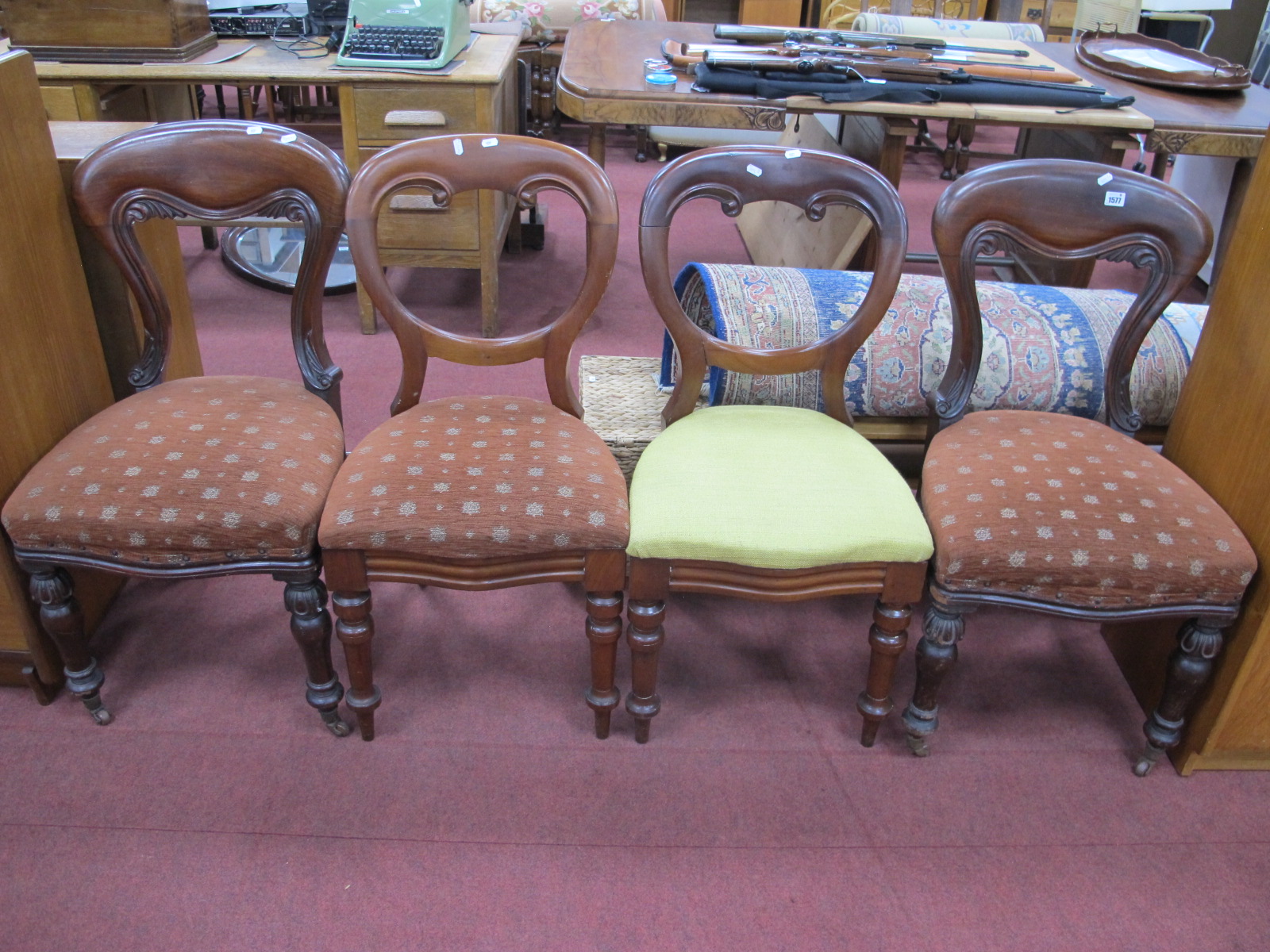 A Pair of XIX Century Mahogany Balloon Back Chairs, with drop in seats, serpentine rails on turned