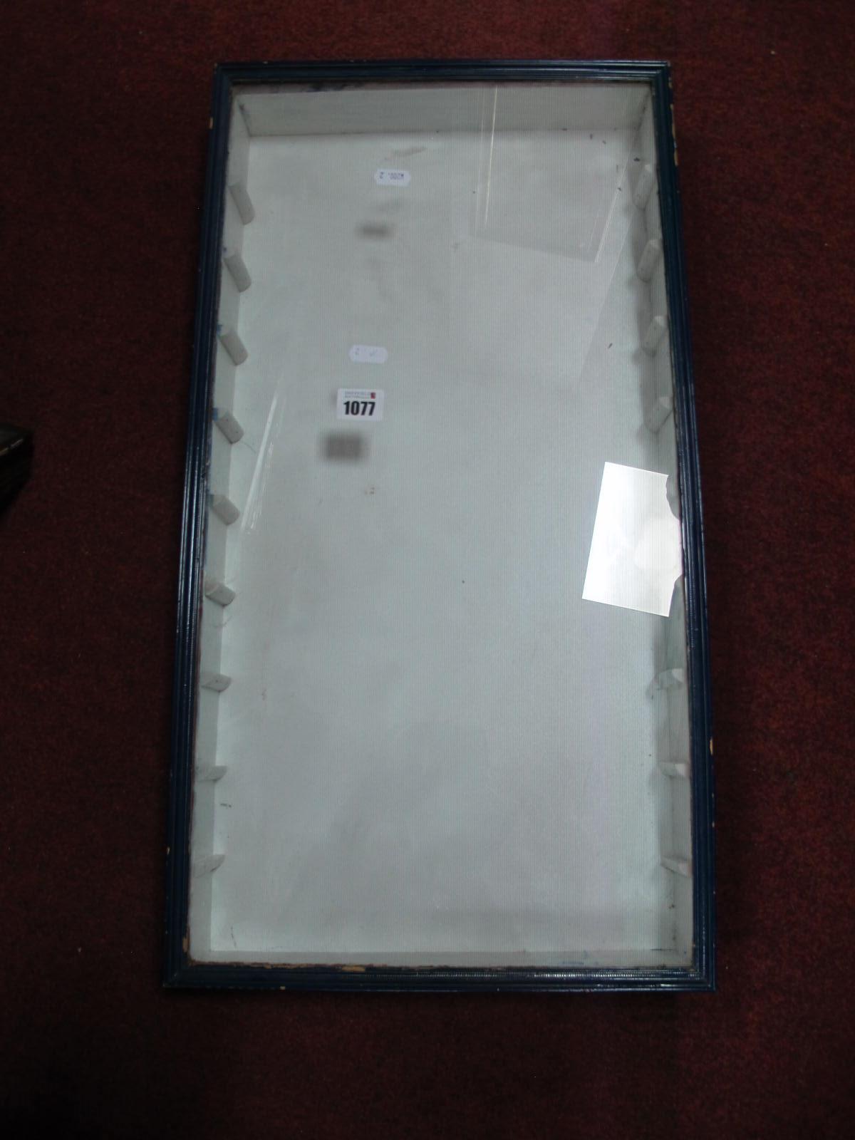 A Wall Mounted Glass Display Case, lacking shelves, 64cm high, 34cm wide, 7cm deep.