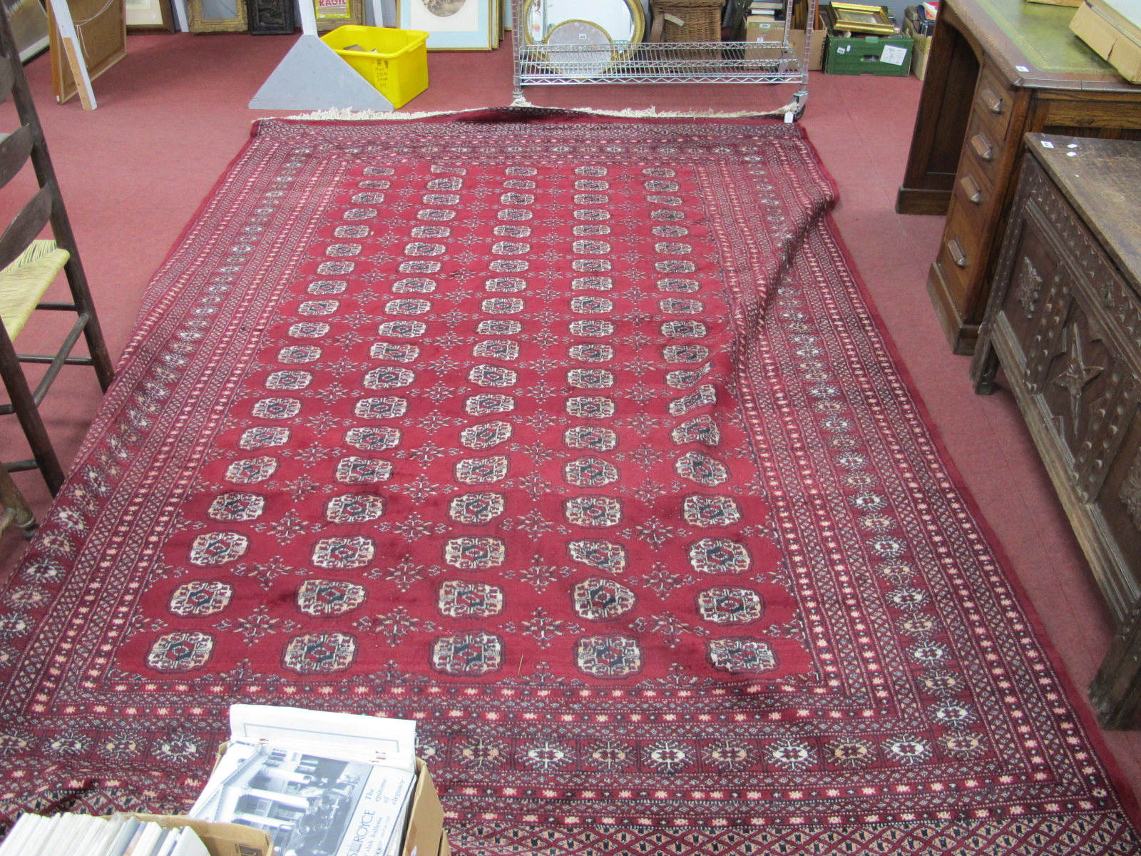 A Middle Eastern Wool Tassled Rug, with five bands of nineteen central medallions, allover geometric