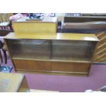 A Teak Bookcase, circa 1970's with sliding glazed doors an lower wooden doors, missing shelf, 152cm