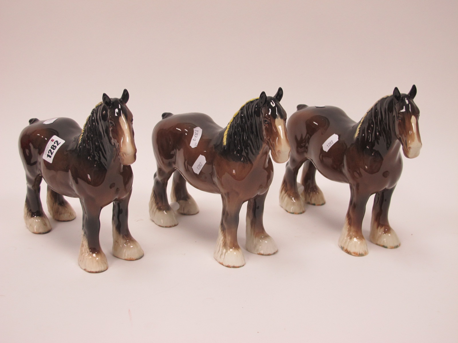 One Brown Beswick Shire Horse, 21cm high with two unmarked shire horses.