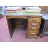 An Early XX Century Oak Single Pedestal Desk, the top with a green leather sciver, four drawers,