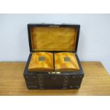 A XIX Coromandel Tea Caddy, with brass strap work 20cms wide, with satinwood caddies.