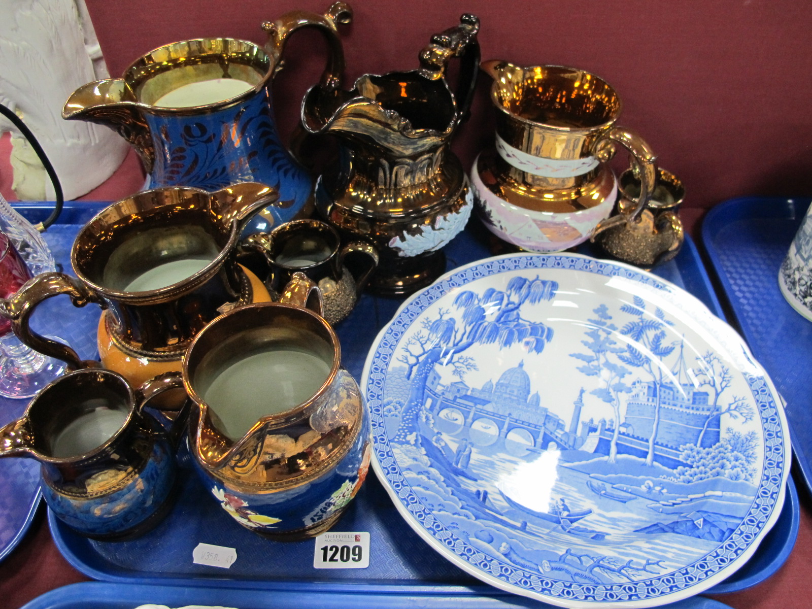 Eight XIX Century Copper Lustre jugs, Blue Room plate.