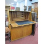 A Remploy Teak Bureau, circa 1970's with fitted interior over two drawers, four cupboard doors, 91cm