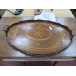 An Early XX Century Mahogany Inlaid Twin Handle Oval Shaped Tray, with a wavy gallery.