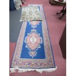A Persian Style Wool Runner, with a blue ground, floral decoration, 368 x 92cm, together with a