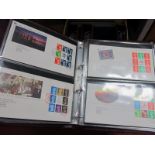 Four Binders Containing Over 160 G.B Decimal FDC's, plus a stockbook of Isle of Man stamps.
