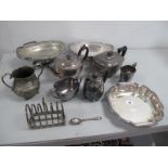 Assorted Plated Ware, including a hallmarked silver teaspoon, a plated three piece tea set, seven