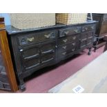A XX Century Dresser Base, with three top drawers, three central drawers, panelled cupboard doors,