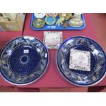 A Pair of Blue Glass Plates, having symmetrical silvered decoration, 31.5cm diameter, three Delft