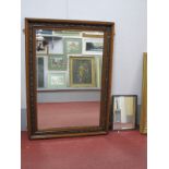 A Late XIX Century Oak Framed Bevelled Wall Mirror, carved with leaves and acorns, 108.5 x 78cm.