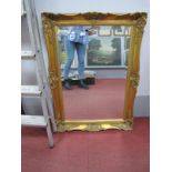 Rectangular Bevelled Wall Mirror, in gilt scroll mount, 92 x 67cm.