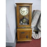 Ensign Oak Clocking In Clock, with Roman numerals to white dial, 100cm high with keys.