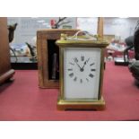 An Early XX Century French Brass Cased Carriage Clock, the white enamel dial with Roman numerals,