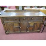 A XX Century Oak Dresser Base, with a low back, top, three top drawers with Gothic decoration,