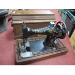 A Late XIX Century Sewing Machine, (cased), no key.