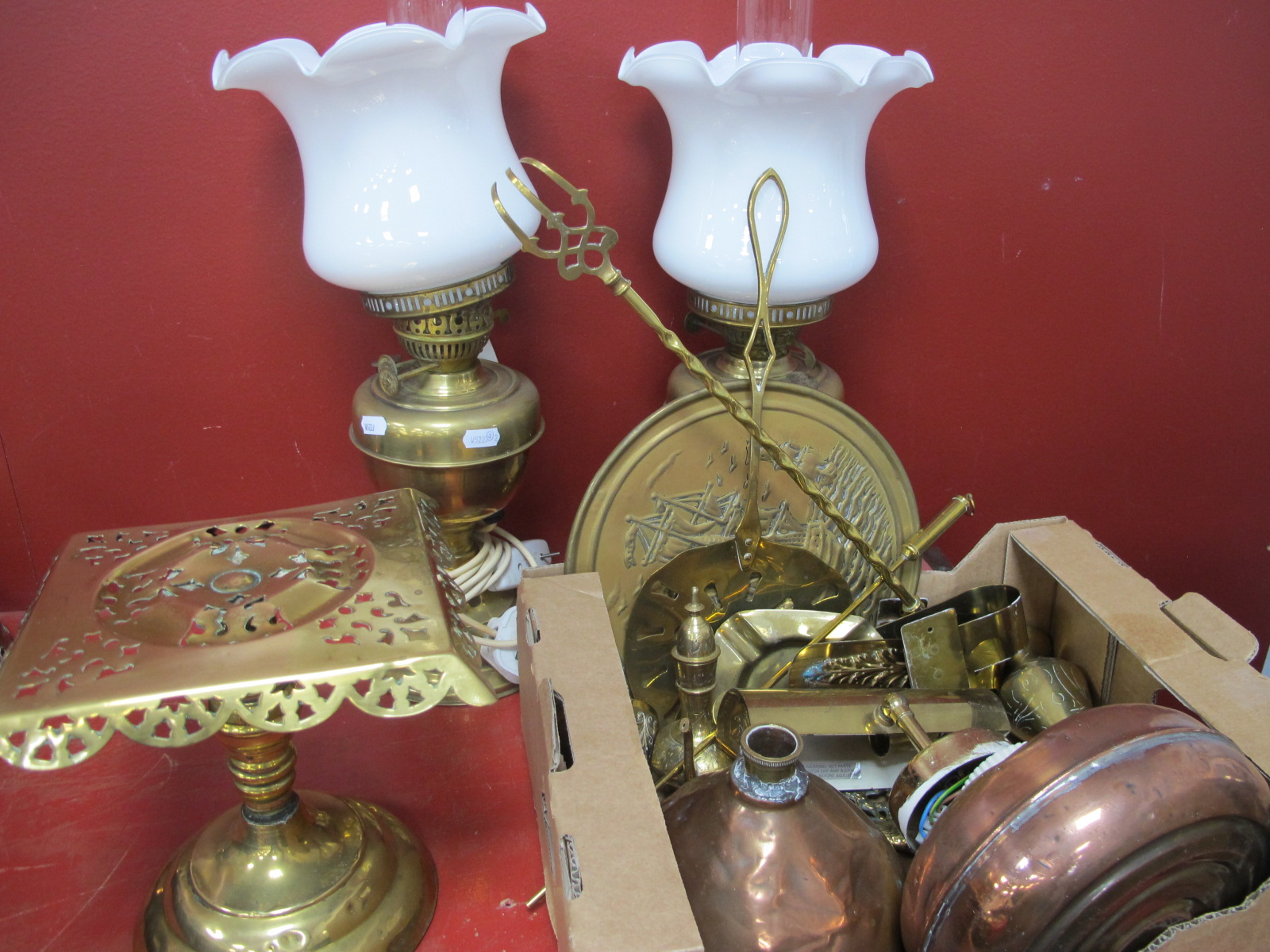 A Pair of Brass Oil Lamps, converted to electricity, trivet stand, other brass ware, copper hot