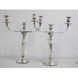 A Pair of Hallmarked Silver Candlesticks, on tapered column, stepped circular base with engraved