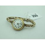 A 9ct Gold Cased Ladies Wristwatch, the unsigned white dial with Arabic numerals and seconds