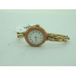 A Decorative Ladies Wristwatch, the unsigned white dial with Arabic numerals, with enamel detail, in