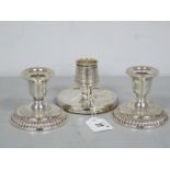 A Pair of Birks Sterling Silver Squat Candlesticks, (loaded), on circular bases, with engraved