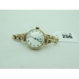 A 9ct Gold Cased Ladies Wristwatch, the unsigned white dial with Arabic numerals and seconds