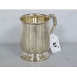 A William Greenwood & Sons Tankard, of baluster form, raised on stepped circular base, engraved "
