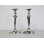 A Pair of Silver Plated Candlesticks, fluted tapered columns, raised on fluted and stepped bases (