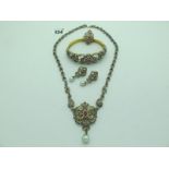 A Highly Decorative Suite of Jewellery, comprising of a bangle, ring, earrings and neckpiece. *AJR