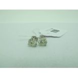 A Pair of Large Single Stone Diamond Earstuds, each (7mm) brilliant cut stone three claw set, (